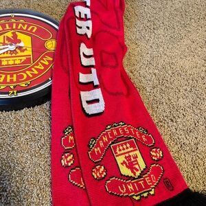 Manchester United scarf and wall clock.  Needs batteries.